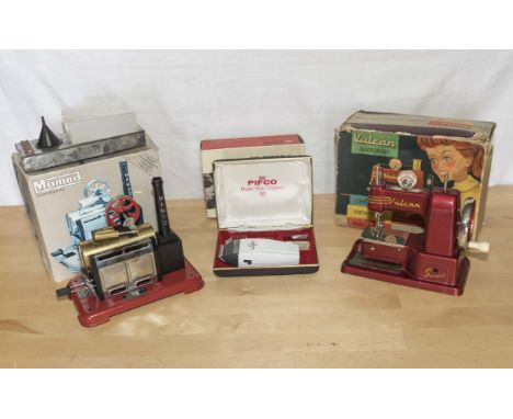 A Mamod steam engine, Child's Vulcan sewing machine and one other