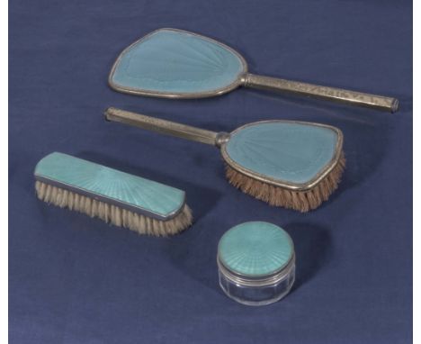 A four piece engine turned enamel dressing table set