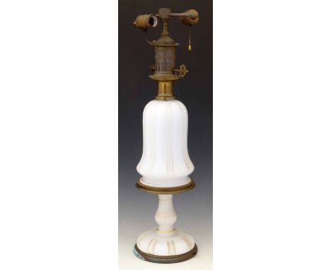 White glass and brass table lamp fitted for electricity, circa 1900, the bell shaped body on a turned stem and domed foot, ov