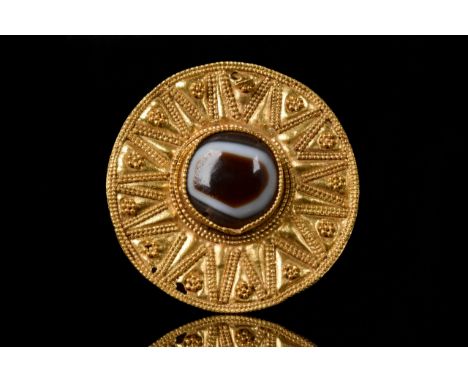 Ca. 300-100 BCHellenistic PeriodA finely rendered Greek Hellenistic gold disc-shaped brooch/pendant, hammered from thin gold,