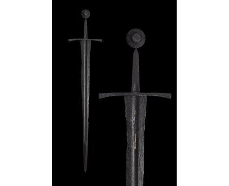 Ca. 1350 ADThis late Medieval sword comprises of a long slender triangular blade with a fuller, three quarters of its length 
