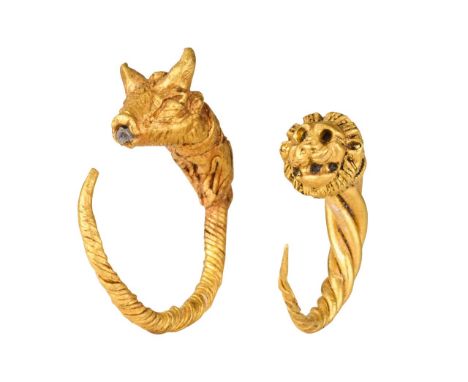 Ca. 300-100 BCA finely rendered pair of gold earrings, each formed from a twisted circular wire hoop, which tapers towards on