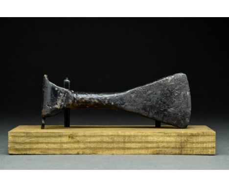 Ca. 900-1000 ADA forged-iron axe head with a perforated socketing shaft, a dense neck, and a vertically oriented blade with g