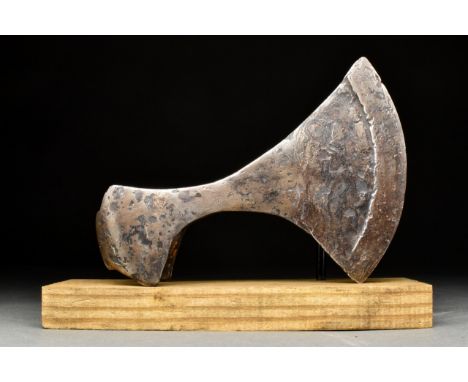 Ca. 900-1000 ADThe broad blade flaring to the curved cutting edge, with eared socket with D-shaped aperture. Commonly referre