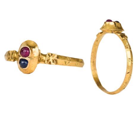 Ca. 1300-1400 ADA gold ring with rounded hoop, flared and cusped shoulders, decorated by flower petal motifs, oval-shaped gol