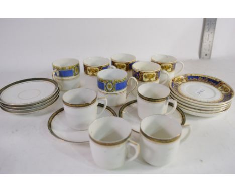 QUANTITY OF DECORATIVE COFFEE CANS AND SAUCERS