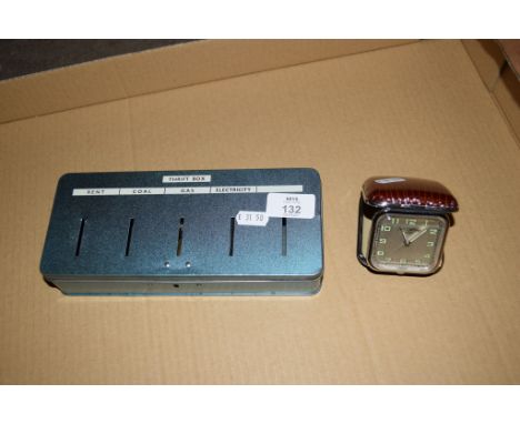 SMALL FOLDING TRAVEL CLOCK TOGETHER WITH A METAL MONEY BOX