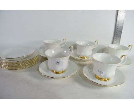 QUANTITY OF ROYAL ALBERT VAL D'OR CUPS AND SAUCERS