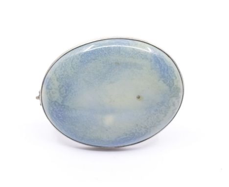 Ruskin - an early 20th Century oval silver set turquoise ceramic cabochon brooch, size approx. 37 x 30mm, pin and C scroll cl