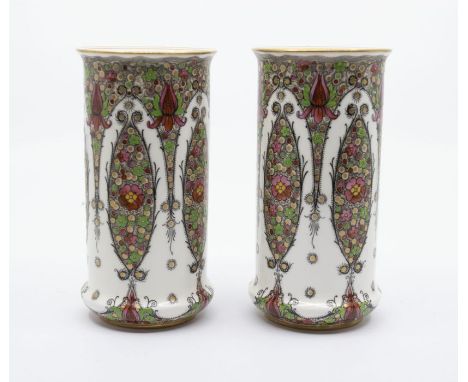 A pair of Royal Worcester shape no: 2510 cylinder vases, floral and jewel painted and applied decoration to the elongated cen