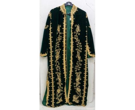 A Saudi Arabian style jacket in a bottle green velvet. Full Length. Lavishly embellished in gold braiding, and in the style o