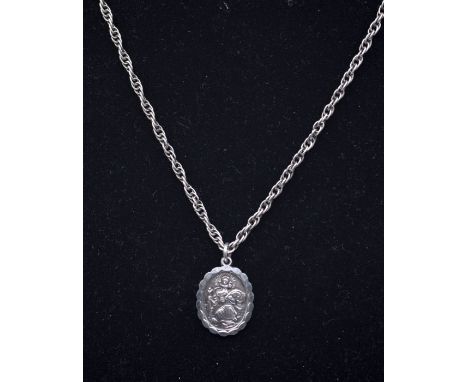 Georg Jensen- a silver St Christopher reversible pendant, oval form depicting St Christopher to one size, the reverse with au