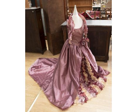 A rose pink evening dress, size 10/12 by Ian Stuart, the bodice is fitted with a Princess line, it is embellished in crystals