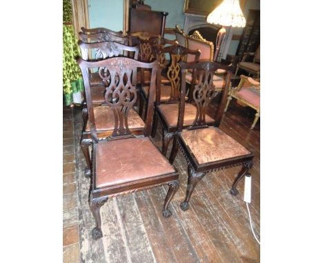 Set of Eight Carved Mahogany Chippendale Dining Chairs With Leather Upholstery and Claw and Ball Supports Each 40 Inches High