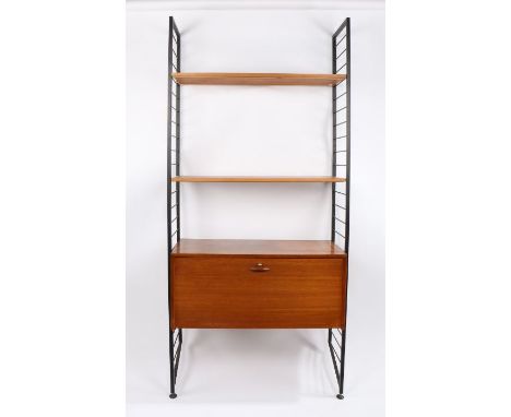 Ladderax shelf unit, the black metal ladder form ends with six cross bars, two teak shelves and fall front cupboard containin