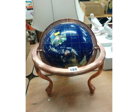 A globe inlaid with semi precious stones