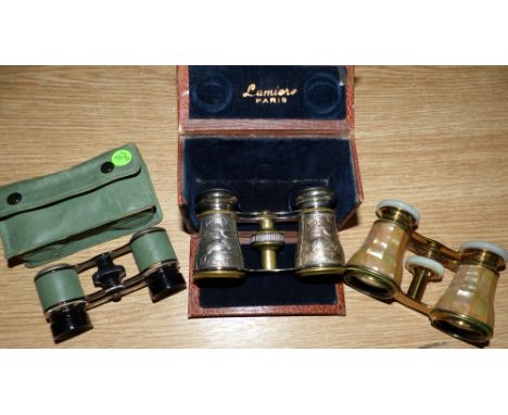 A cased pair of opera glasses with hunting scenes in relief, by Lumiere Paris, in leather case and 2 other pairs of opera gla