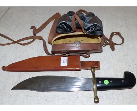 A vintage Bowie knife in leather scabbard; a pair of WWI field glasses in leather case