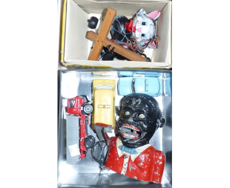A Pelham puppet "Cat", in original box; 3 diecast cars; a black boy money box