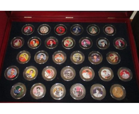 Elvis Presley:  a collection of colourised US Half Dollars, each illustrating one of  his movies