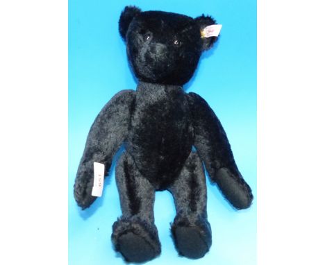 A Steiff teddy bear with original box and label:  "Schwartzbär", 35 cm