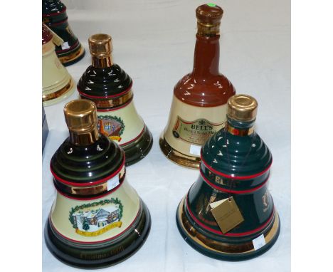 Four Wade Bell's whisky decanters with contents, Christmas 1990, 1994 & 1991; a standard decanter