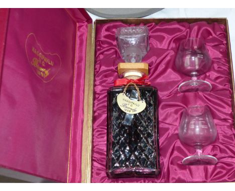 A cased decanter of Haggipavlu VO brandy with 2 small brandy glasses