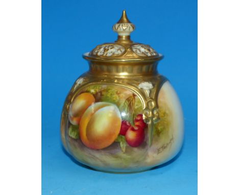 A Royal Worcester pot pourri vase with pierced and gilded top decorated with peaches and cherries against a naturalistic grou