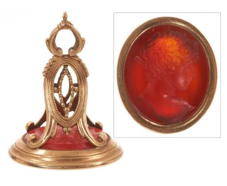 Georgian gold seal with an oval intaglio carved carnelian depicting a young classical Roman male bust in profile, in a gold m