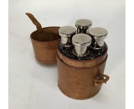 Early 20th century good quality set of four hunting flasks/spirit bottles in leather case, 15cm highThe glass flasks are in v