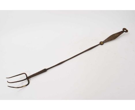 Early 19th century copper and brass inlaid wrought iron toasting fork, the handle inlaid with initials, with suspension loop,