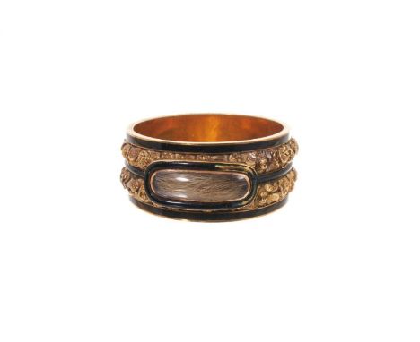 George III gold and enamel mourning ring, the wide band with glazed compartment of hair on a double row of foliate gold bands