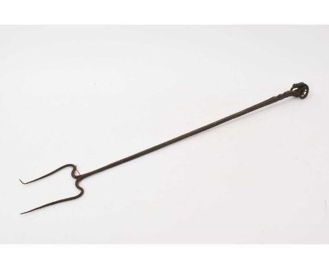 Arts and Crafts wrought iron toasting fork, with ram's head terminal, 64cm long. Provenance: The Caspall Collection, previous