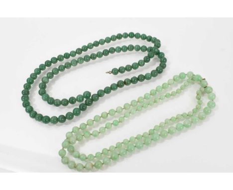 Two Chinese green jade/hardstone bead necklaces to include a string of graduated beads on 9ct clasp.
