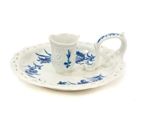 A rare Worcester chamber candlestick, circa 1770, painted in blue with the Floral Sprays pattern, with scroll-moulded and pie