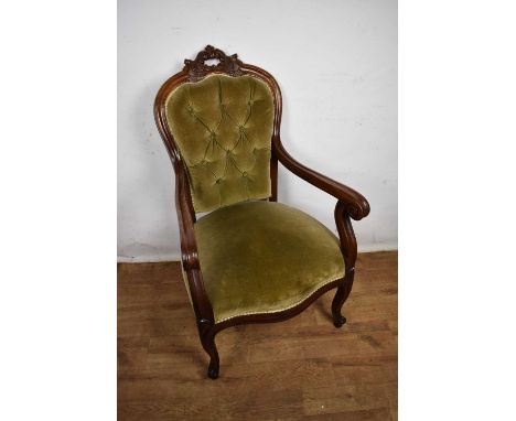 Victorian button back open armchair, in carved walnut showwood frame on cabriole legs