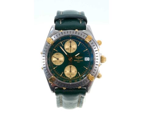 Breitling Chronomat automatic wristwatch with a circular green dial, three gold coloured subsidiary dials, date aperture and 