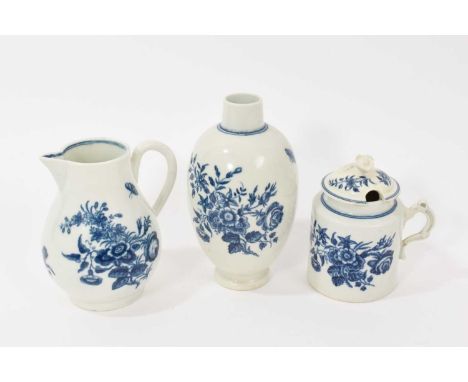 Worcester tea canister, sparrow beak jug, and mustard pot and cover, circa 1770-80, all printed in blue with the Three Flower
