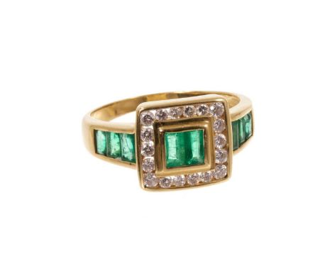 Emerald and diamond ring with step cut emeralds and a square border of brilliant cut diamonds flanked by further emeralds to 