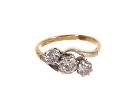 Antique diamond three stone ring with three old cut diamonds in platinum claw crossover setting in 18ct gold shank. Estimated
