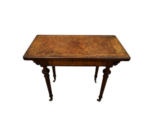 Victorian figured walnut card table, the rounded rectangular fold-over top with red baize lined interior and well below, rais