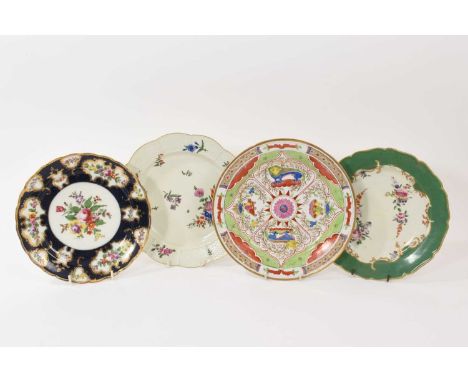 A Worcester plate decorated with the Dragons in Compartments pattern, another Worcester plate with flowers on a green ground 