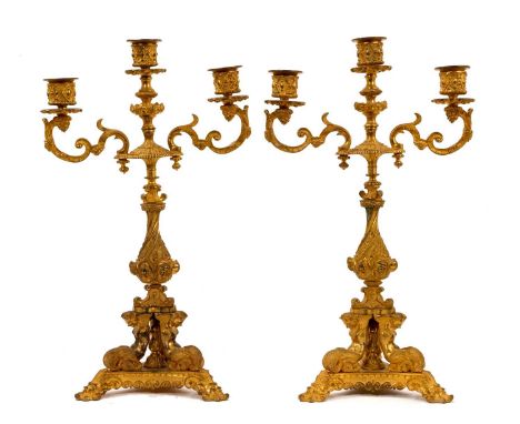Pair of ornate 19th century French Napoleon III ormolu three light candelabra, with scrolling acanthus arms terminating in bu