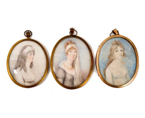 Three George III portrait miniatures on ivory, each oval and depicting young women, including woman with lace headscarf named