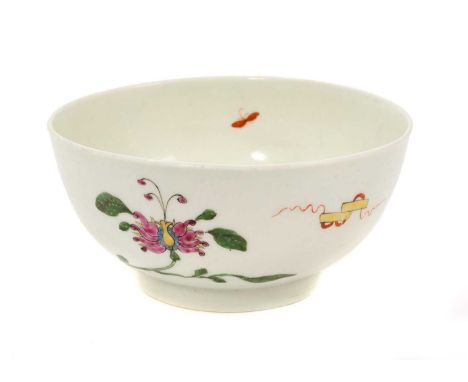 A Worcester Hibiscus pattern bowl, circa 1752-54, with ribboned emblem, large honeysuckle flower, trailing vines and an insec