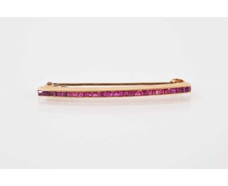 Art Deco ruby bar brooch/tie pin with a continuous line of twenty two calibre cut rubies in a gold setting (stamped 585) 45mm