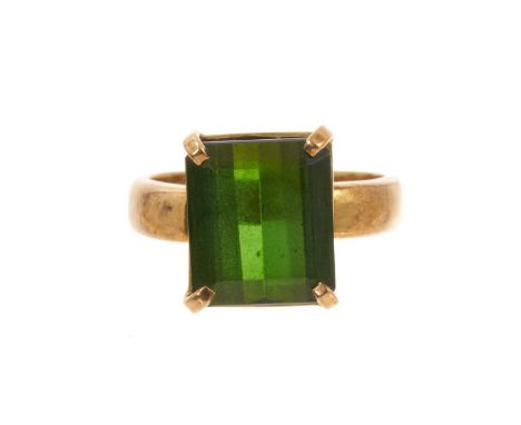 Green tourmaline ring with a rectangular step cut tourmaline, measuring approximately 12.8mm x 11.2mm x 6.7mm, in four claw s