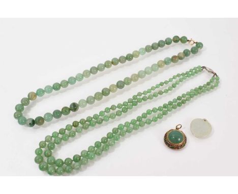 Chinese jade/green hardstone double-strand necklace with two strings of graduated beads measuring 8.4-3.8mm on a diamond set-