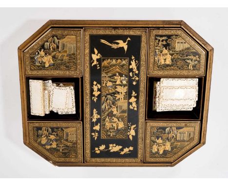 Late 18th / early 19th century Chinese black lacquered gaming box, of canted rectangular cushion form raised on paw feet, the