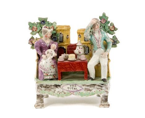  Early 19th century Staffordshire pearlware Obadiah Sherratt type figure group named ‘Tee Total’, showing a couple seated nex